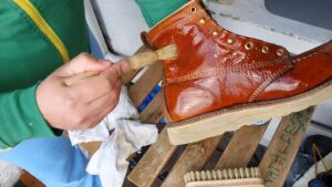 Applying conditioner to a leather work boot